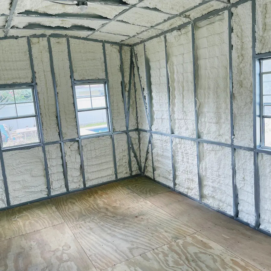 Closed-cell spray foam insulation applied to wall cavities in a residential project in Three Lakes